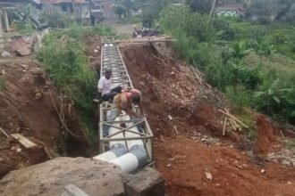 IMG 20250101 WA0001 Perbaikan Jalan Longsor di Desa Cijengkol Sukabumi Dimulai