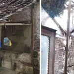 Ketua RT Dadan bersama bayinya di depan rumahnya yang nyaris ambruk. (Prima Meidiandi/Telusurbisnis)